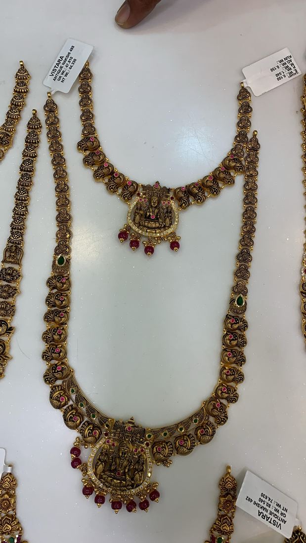 Antique-finish Lakshmi haram set with ruby-colour stones
