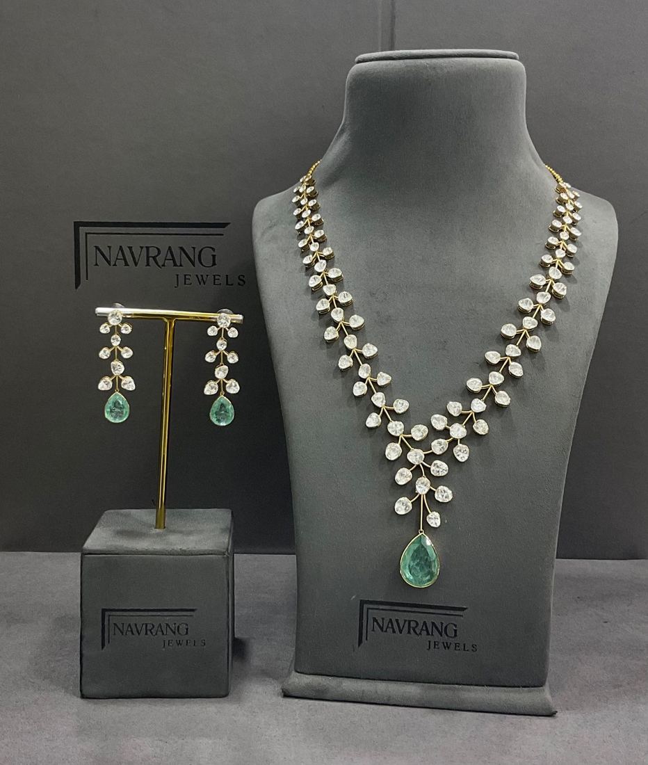 Diamond leaf-design necklace with matching earrings and green drop