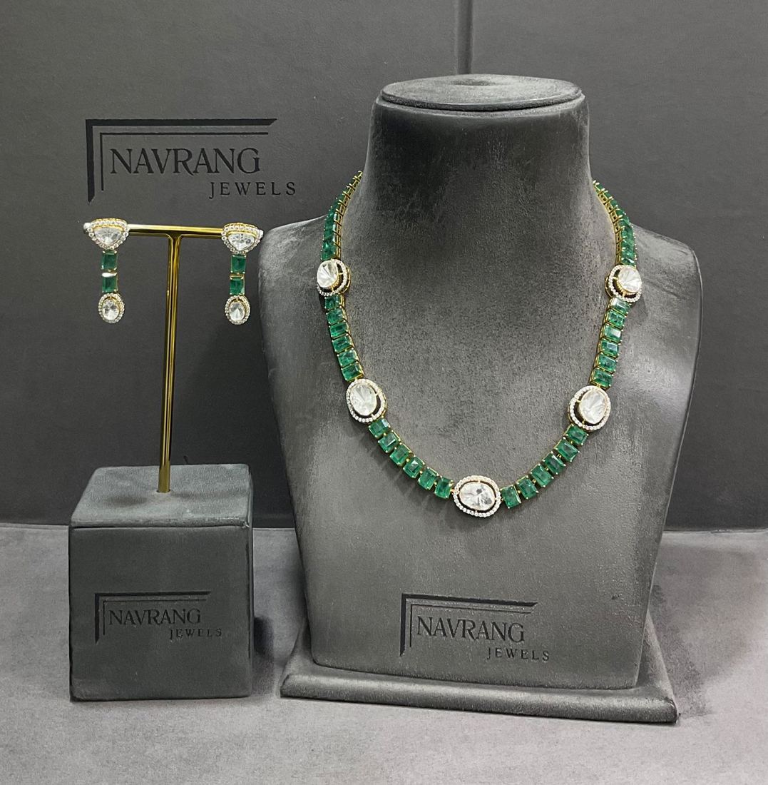 Long necklace with green stones and a diamond centre piece