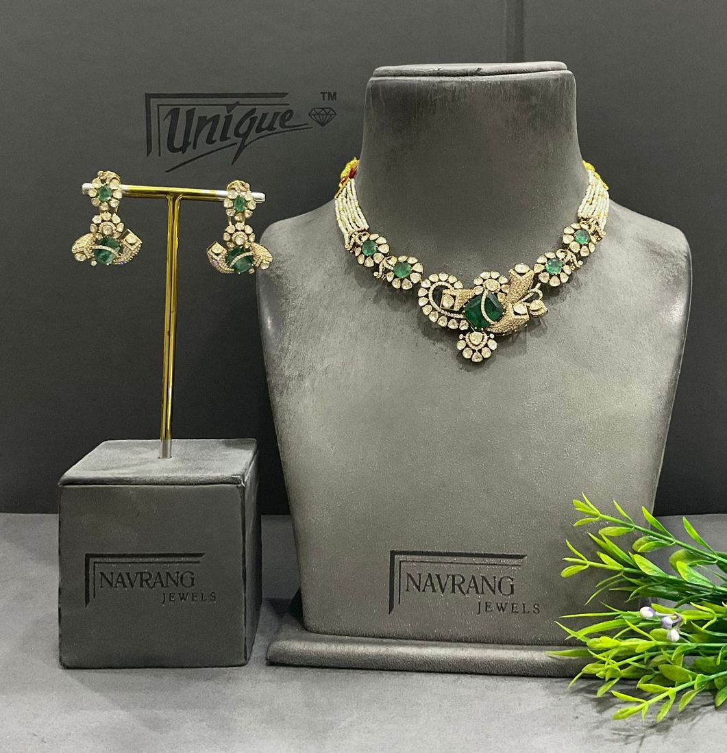 Diamond choker with pearl strands and green stones