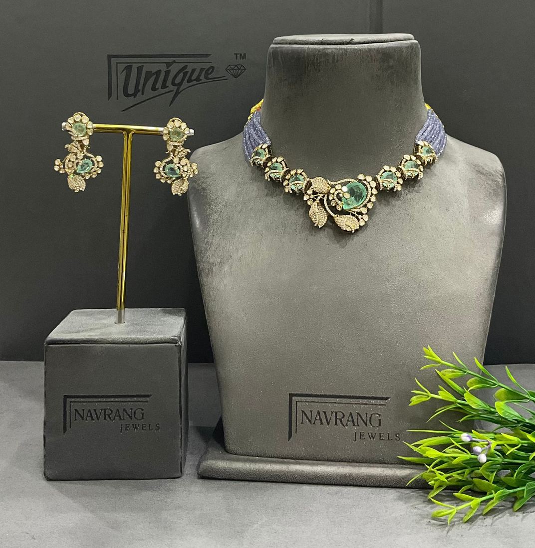Diamond choker with blue bead strands and green centre stone