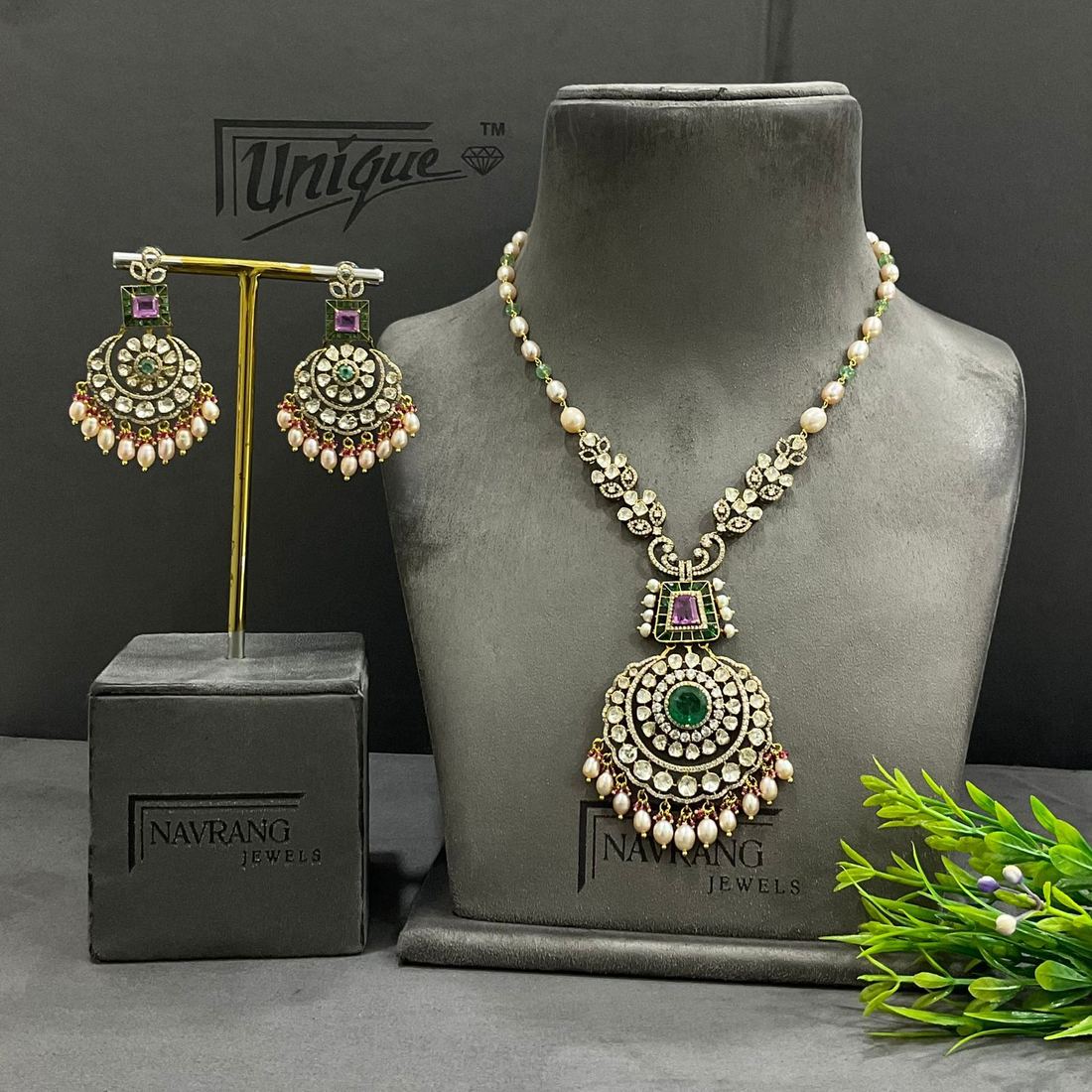 Long diamond necklace with pearl and green stone pendant and earrings