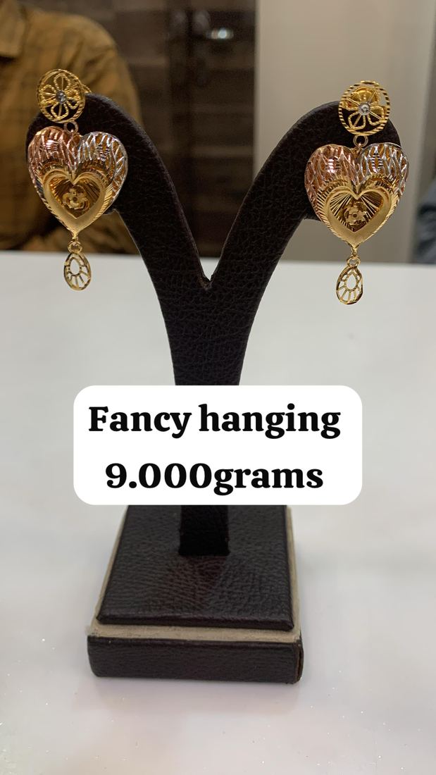 Gold heart-shaped hanging earrings