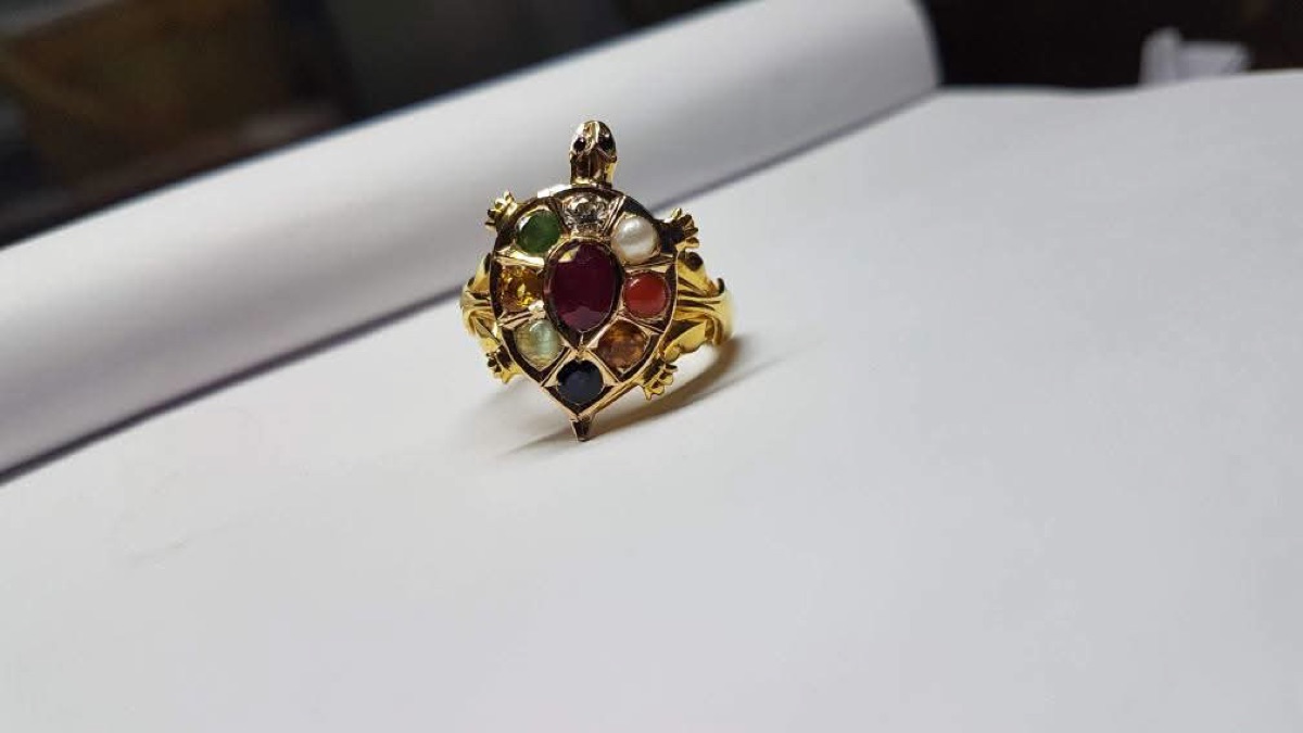 Gold tortoise ring set with navaratna stones