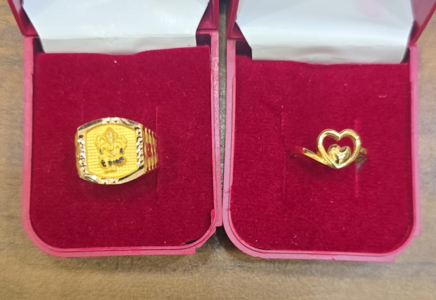Gold Ganesha ring and heart ring in boxes